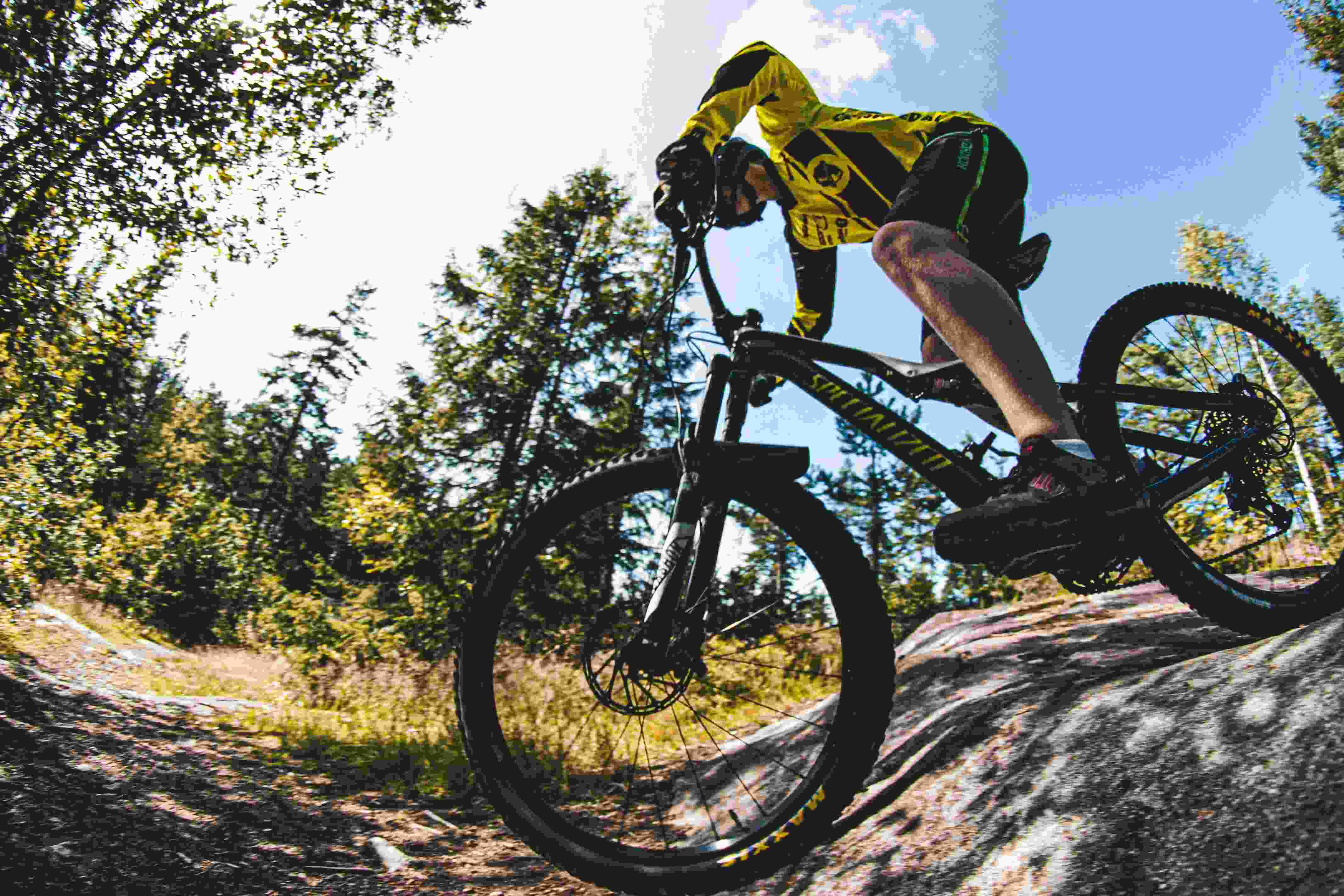 Close up of biker riding over rocky terrain