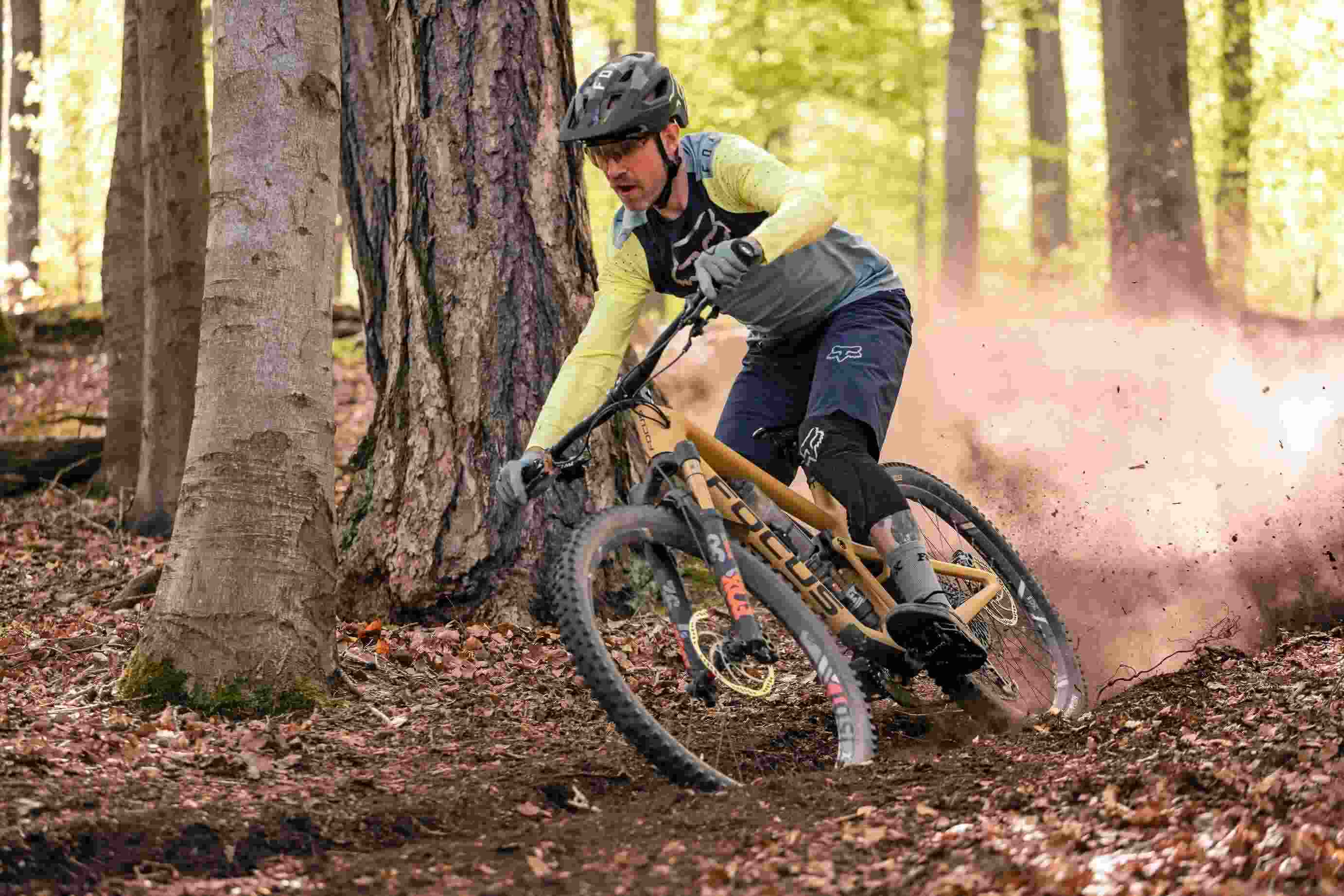 Biker riding through woodland trail route