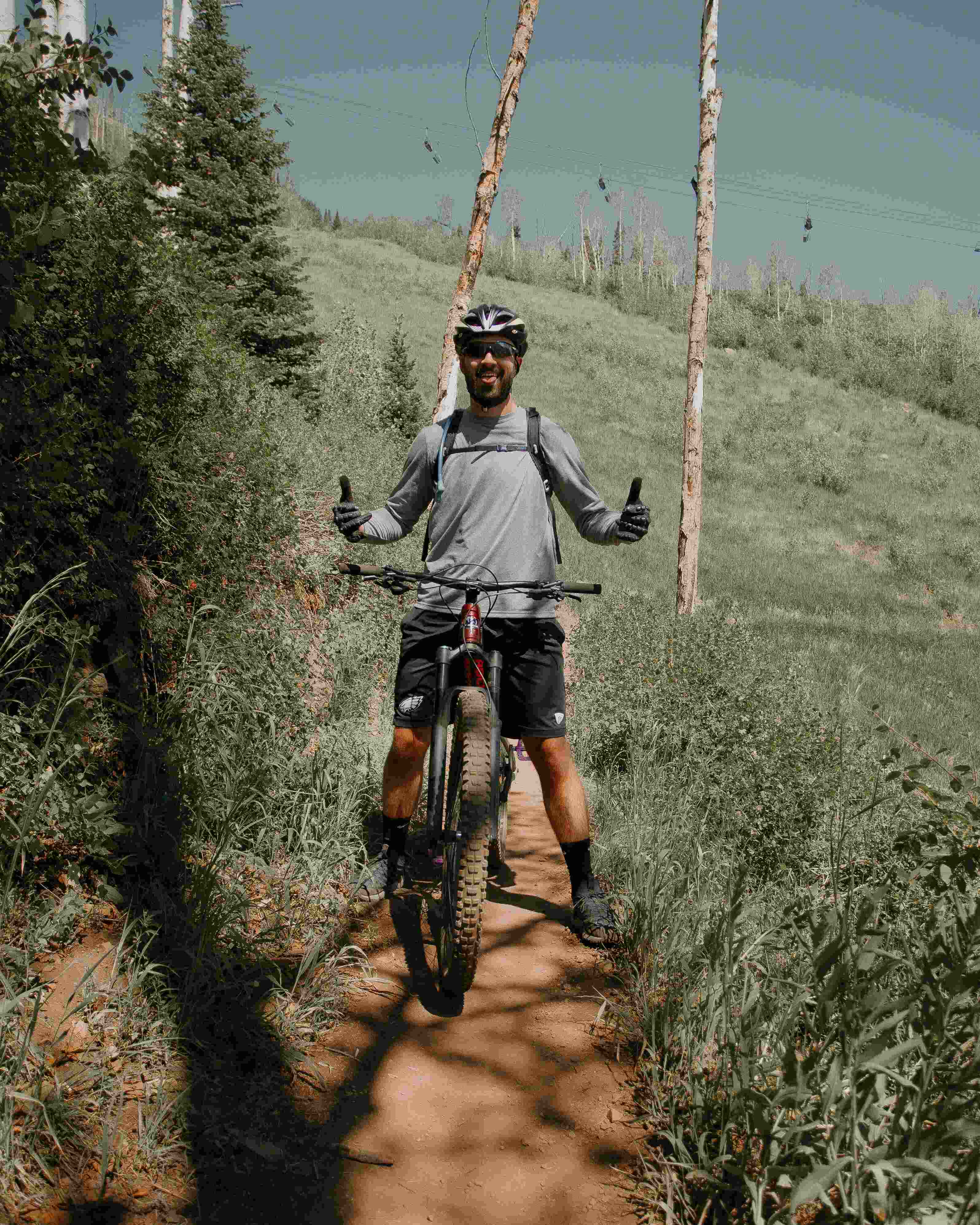 Man giving thumbs up on bike